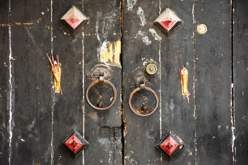 Retro wooden door and antique lock door chinese old style with joss stick at house in Chaozhou at Teochew in Guangdong, China