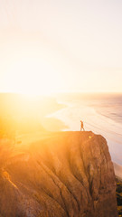 Aerial View of Beautiful Beach Coastline with Person on top of Cliffs Along the Great Ocean Road Australia