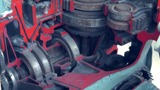 Closeup View Of Engine Gears Whell. Mechanism. Factory.Grey And Red Colours.Moving.