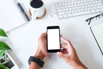 Top view office stuff with notepad, laptop and coffee cup mouse notepad shot.blank screen mobile phone and supplies on white desk workspace and copy space.