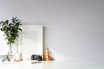 Mockup workspace desk and copy space books,plant and coffee on white desk..