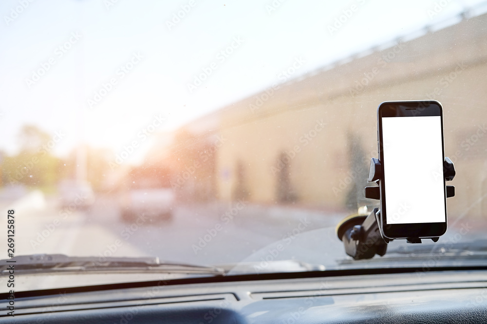 Poster cropped shot view the driver uses the phone while driving. modern smart phone with round edges. isol