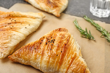 Delicious samosas on parchment, closeup