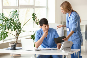 Young medical assistants working in clinic