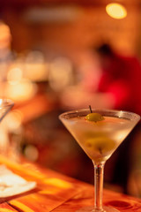 Closeup of martini glass on bar