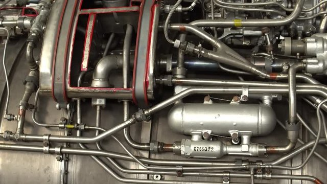 Complicated Metal Construction with a Lot of Small Pipes. Part of an Airplane with Different Steel Elements.