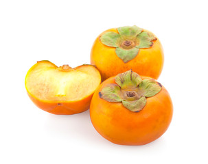 Tropical fruit persimmon. Kaki with leaves on white background