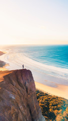 Aerial View of Beautiful Beach Coastline with Person on top of Cliffs Along the Great Ocean Road Australia - 269129083