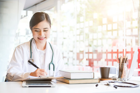 Healthcare technology concept.Woman Doctor Working using a laptop computer contact with patient.