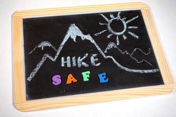 Hiking safety message on chalkboard