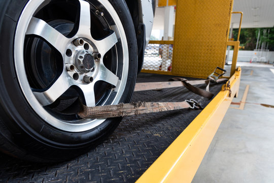 Car Tied With Security Strap On Flatbed Tow Truck