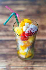 Glass of Frozen Tropical Fruits to prepare a healthy Smoothie