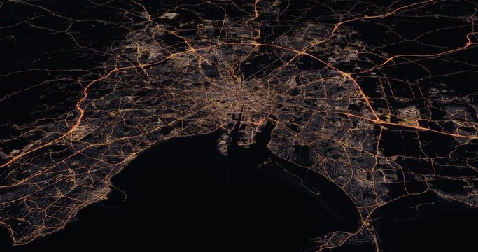 Aerial night view of city of Dublin Ireland. Traffic and street light glowing. Camera flying high above and moving forward and panning down over from space filming cinematic. 3d animation rendering.