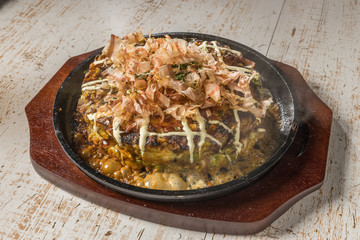 お好み焼き Okonomiyaki is a Japanese-style pancake