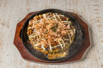 お好み焼き Okonomiyaki is a Japanese-style pancake