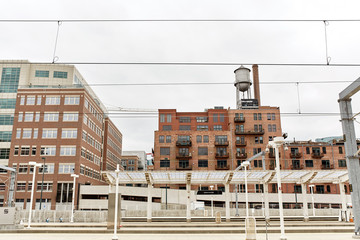 Condominiums and highrise buildings behind train tracks downtown at Union Station in Denver, Colorado