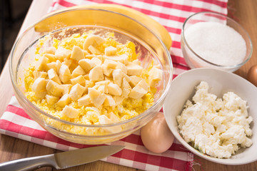 Cooking a casserole cake with the ingredients of eggs, sugar and bananas