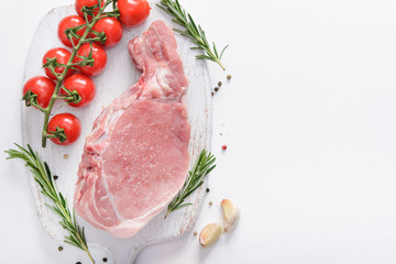 Raw pork steak  with rosematy