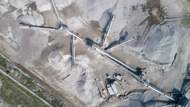 Aerial view of the granite - gravel pit. Equipment for processing and crushing stones