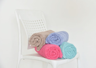 Soft cotton bath towel on chair. Cotton bath Towel isolated on white background.