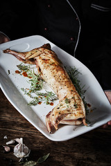 Roasted fresh wild rabbit venison on a platter