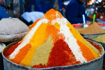 Close-up of traditional, colorful mixture of spices in local bazaar in Rissani, Morocco