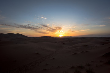 Fototapeta na wymiar Sunset on the Erg Chebbi sand dunes near Merzouga, Morocco