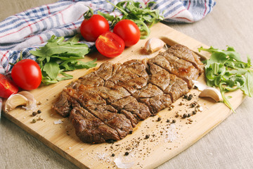 A beef steak well done with vegetables