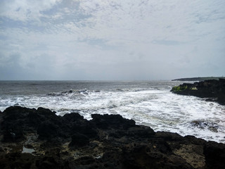 waves crashing on rocks