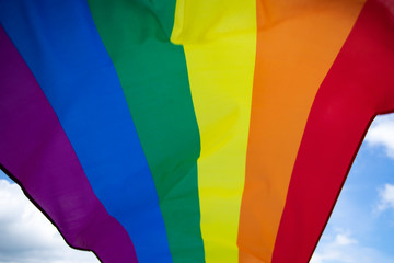 Colorful LGBT flag blows in the breez.
