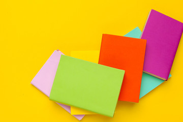Books on a yellow background