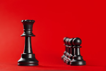 Chess business success, leadership concept. Red background.