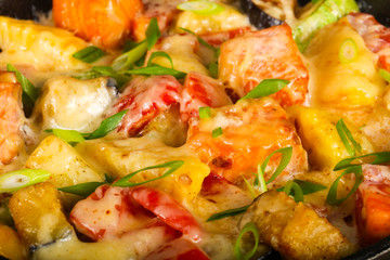 Baked salmon with potato in pan