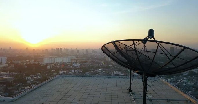 opening panorama of Bangkok, Thailand over satellite on a rooftop of a skyscraper, sunrise