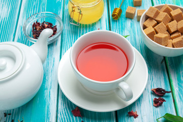 healthy herbal tea over blue background