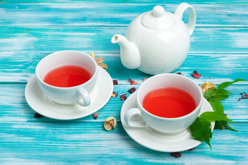 healthy herbal tea over blue background