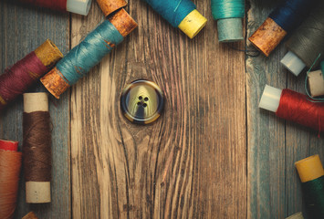 vintage button and spools of thread