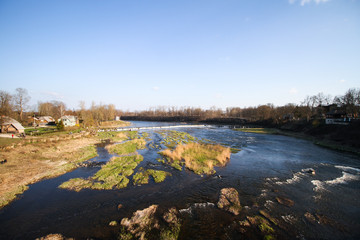 Beautiful view countryside waterfall with fish flying in river Venta.