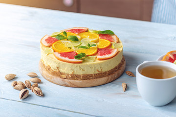 Raw citrus cake with grapefruit, orange, lime and lemon. Healthy fresh summer dessert. Gluten free, no baking vegan food