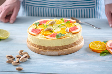 Raw citrus cake with grapefruit, orange, lime and lemon. Cooking at home healthy summer vegan dessert