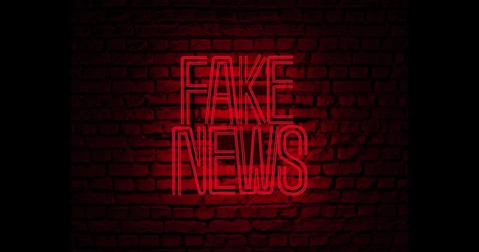 Neon sign stating fake news in red color over a red brick wall at night. Video render.