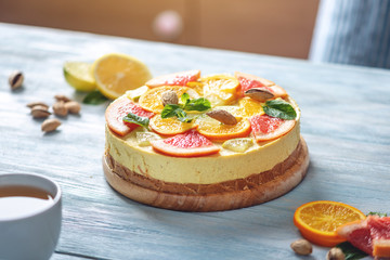 Raw citrus cake with grapefruit, orange, lime and lemon. Fresh summer dessert. Gluten free, no baking vegan food