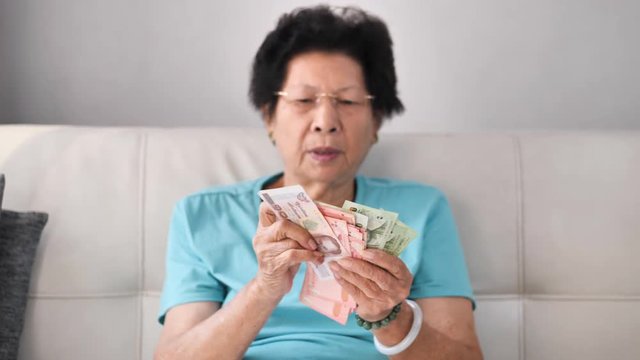 Senior woman receive subsistence allowance from government, lifestyle concept.