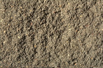 rough concrete wall with traces of erosion