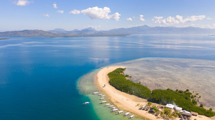 The island of white sand with mangroves. The sea landscape of Honda Bay, view from above. sand bar on coral reefs, Palawan, Philippines.