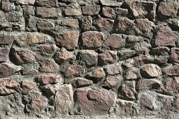 closeup of the surface of the old stone masonry
