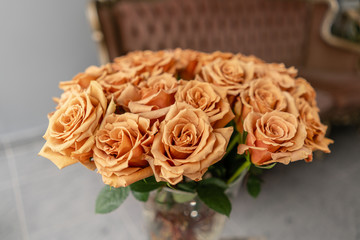 Caramel color, tofi roses in a glass vase. Beautiful rose flower for catalog or online store. Floral shop concept . Beautiful fresh cut bouquet. Flowers delivery