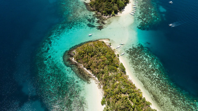 Top view of small tropical island in the Philippines. Island hopping tour in Port Barton