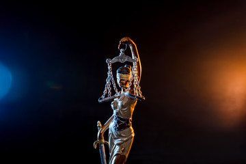 Statue goddess of justice on dark background