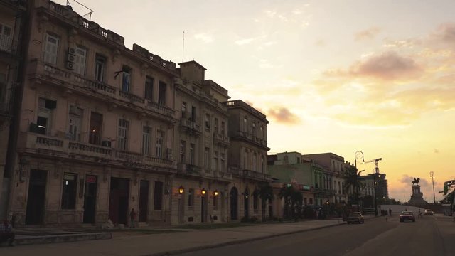 Urban street scenery in Havana at sunset with great orange sky, Cuba